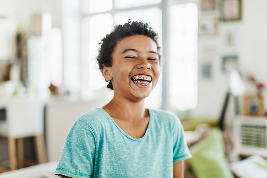 Boy wearing braces smiling