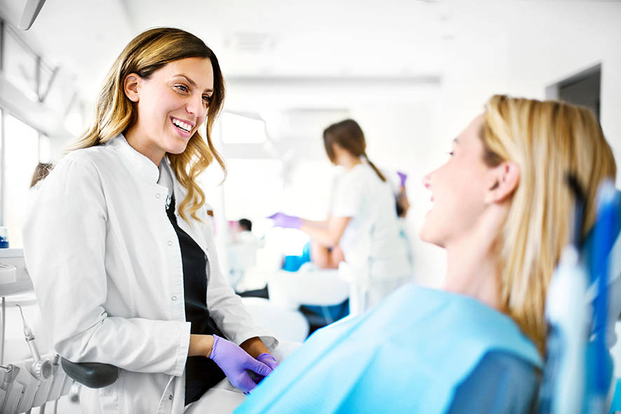 Dentist and patient talking