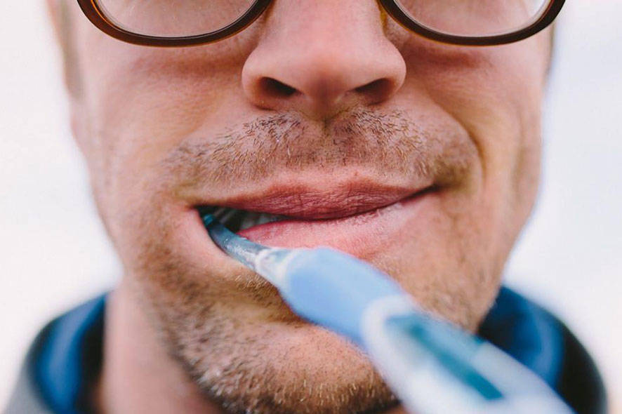 man with toothbrush