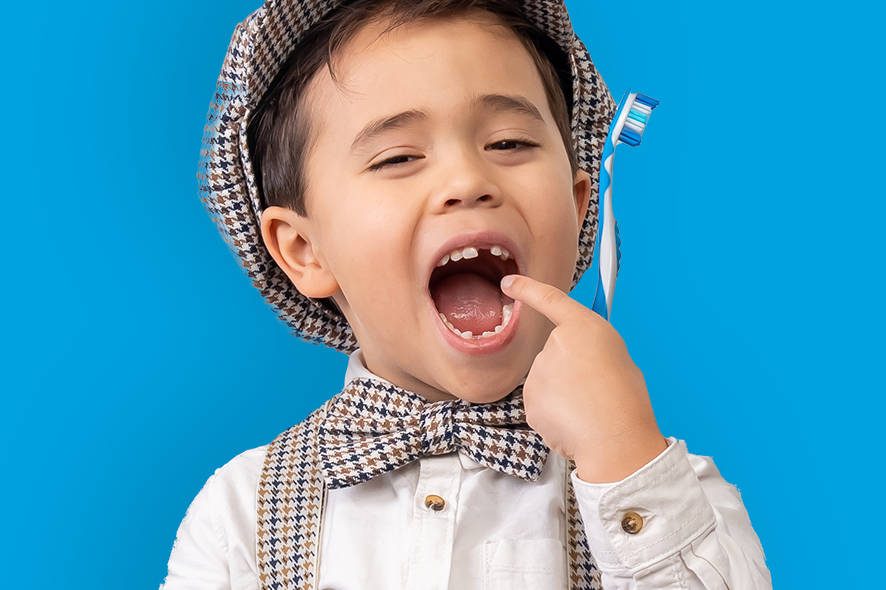 Boy with wobbly tooth
