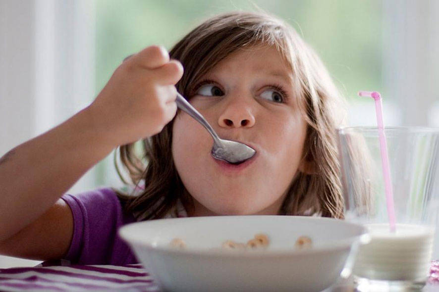 girl eating cereal