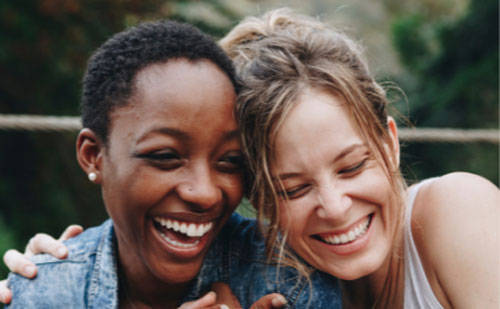 Two smiling women
